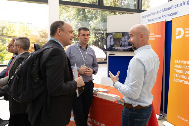 Group of people talking at an exhibition stand